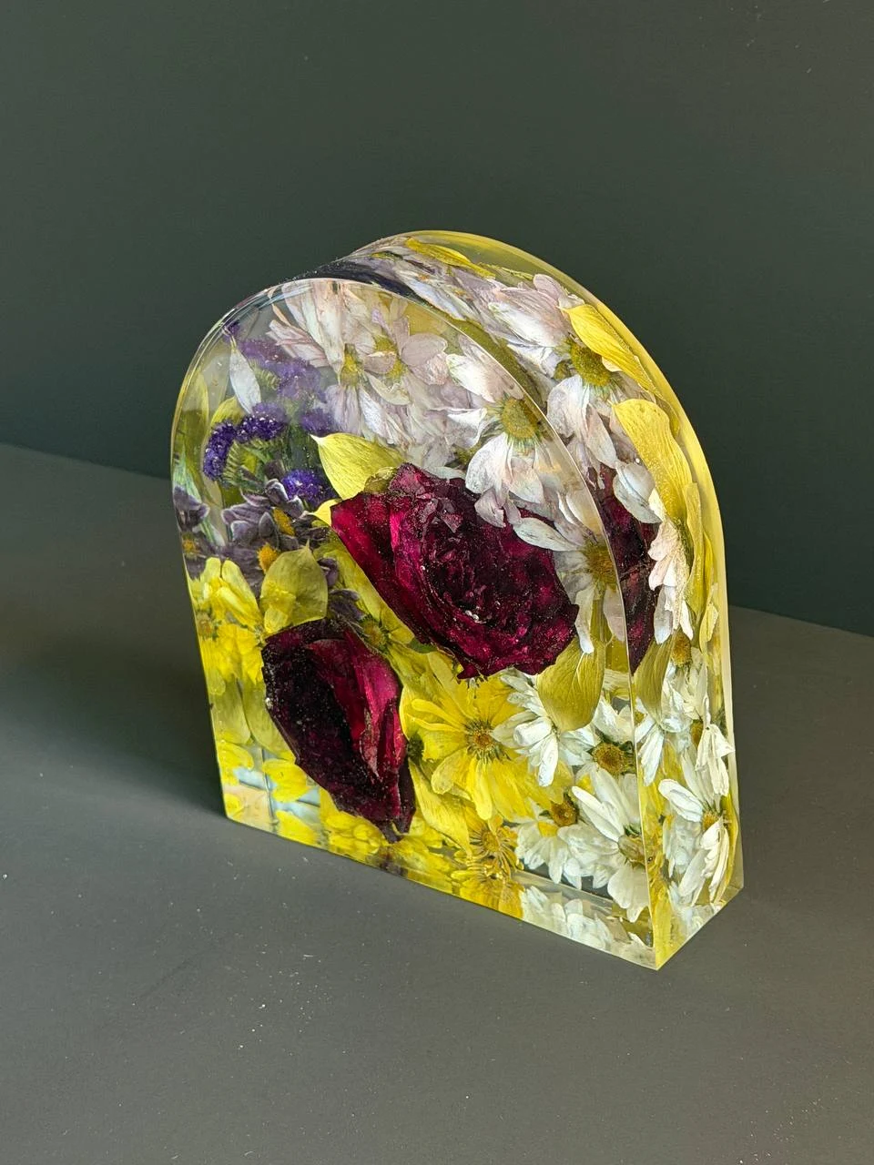 Angled view of a clear resin memorial flower arch