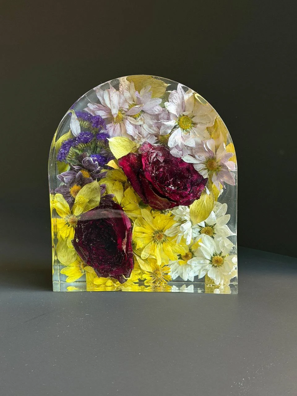Portrait view of a clear resin memorial flower arch